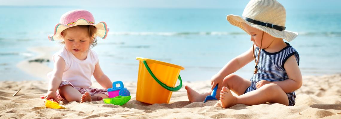 How should you dress your baby in hot weather?
